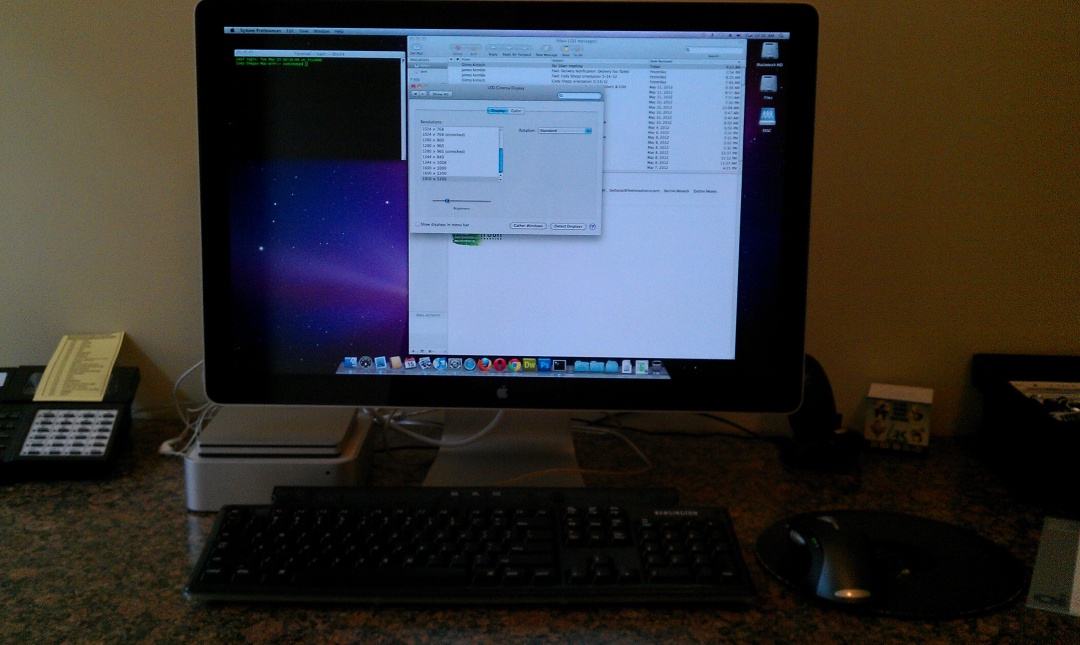 A widescreen monitor and a mac mini